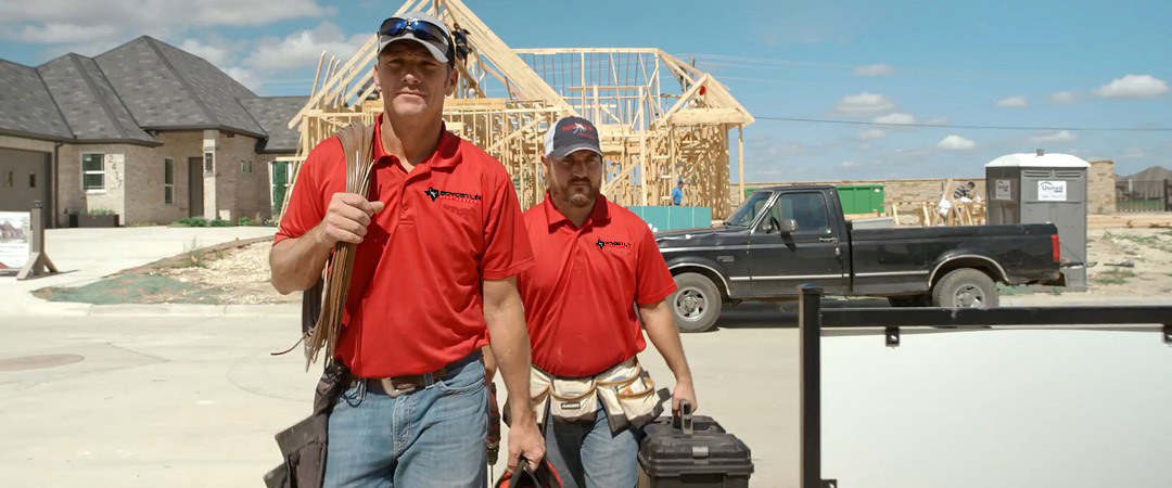 2 technicians leaving commercial worksite