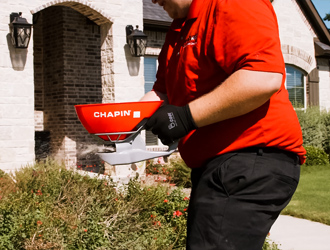 Pest Force technician using granules for pest control