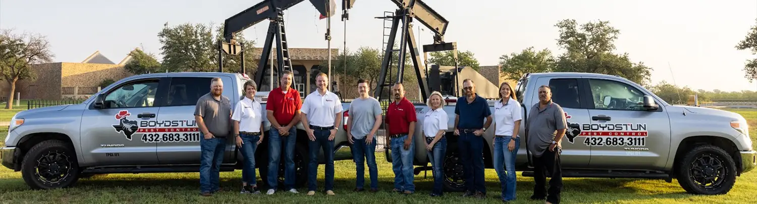 Boydstun pest control team with company trucks