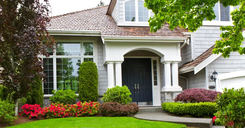 Front of a residential home with landscaped yard